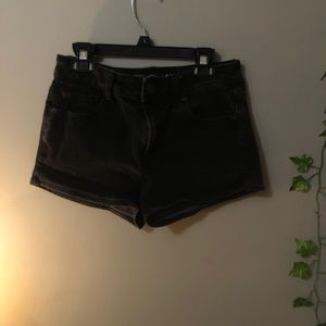 black jean shorts.